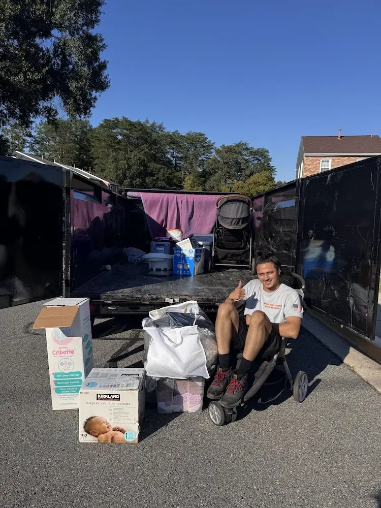 Daniel filling junk removal trailer with donations
